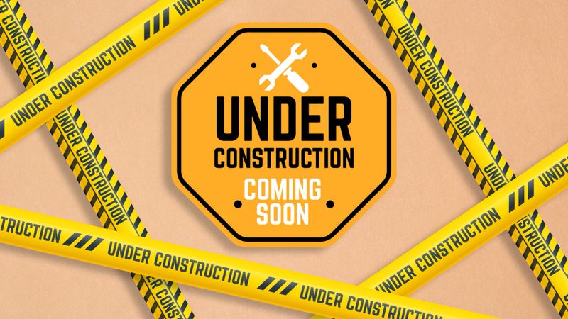 An "UNDER CONSTRUCTION COMING SOON" sign with tool icons, surrounded by caution tape on cardboard. Indicates website maintenance, development work in progress, upcoming launches, or construction site warnings.