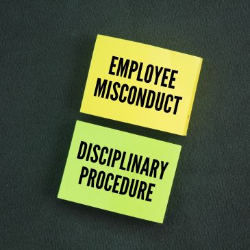 Sticky notes with 'Employee Misconduct' and 'Disciplinary Procedure' text.