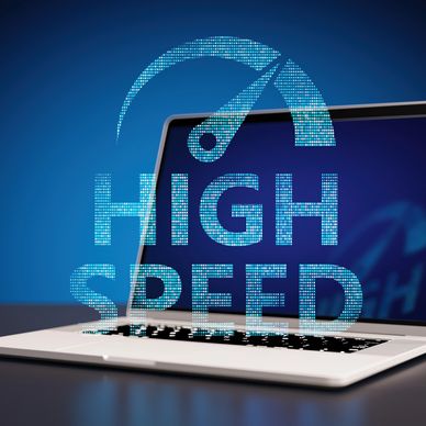 Laptop with high speed digital speedometer graphic overlay.