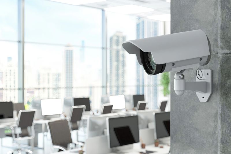 Surveillance Camera Monitoring Modern Office Workspace. 3D Render