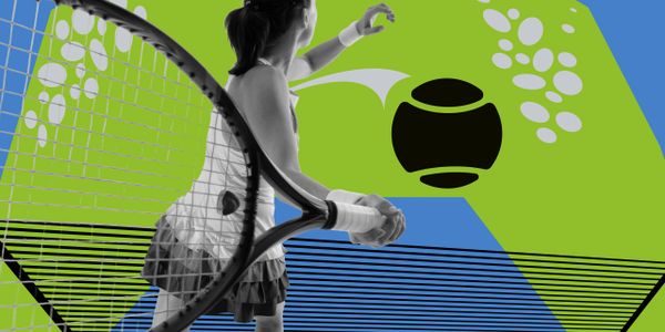A female paddle tennis player preparing to hit the ball on a green and blue court.