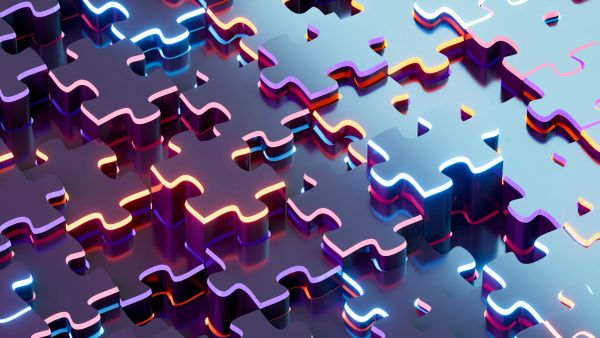 3D glowing puzzle pieces fitting together.