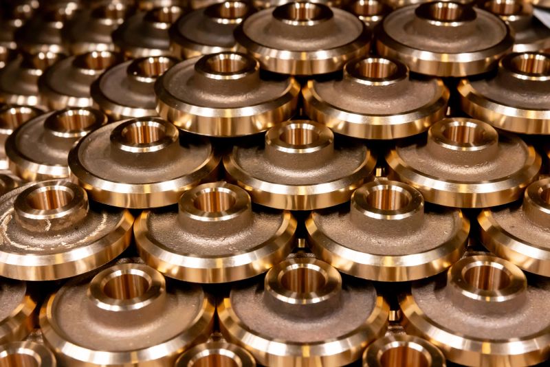 Close-up on bronze metal machine parts - metallurgy industry concepts