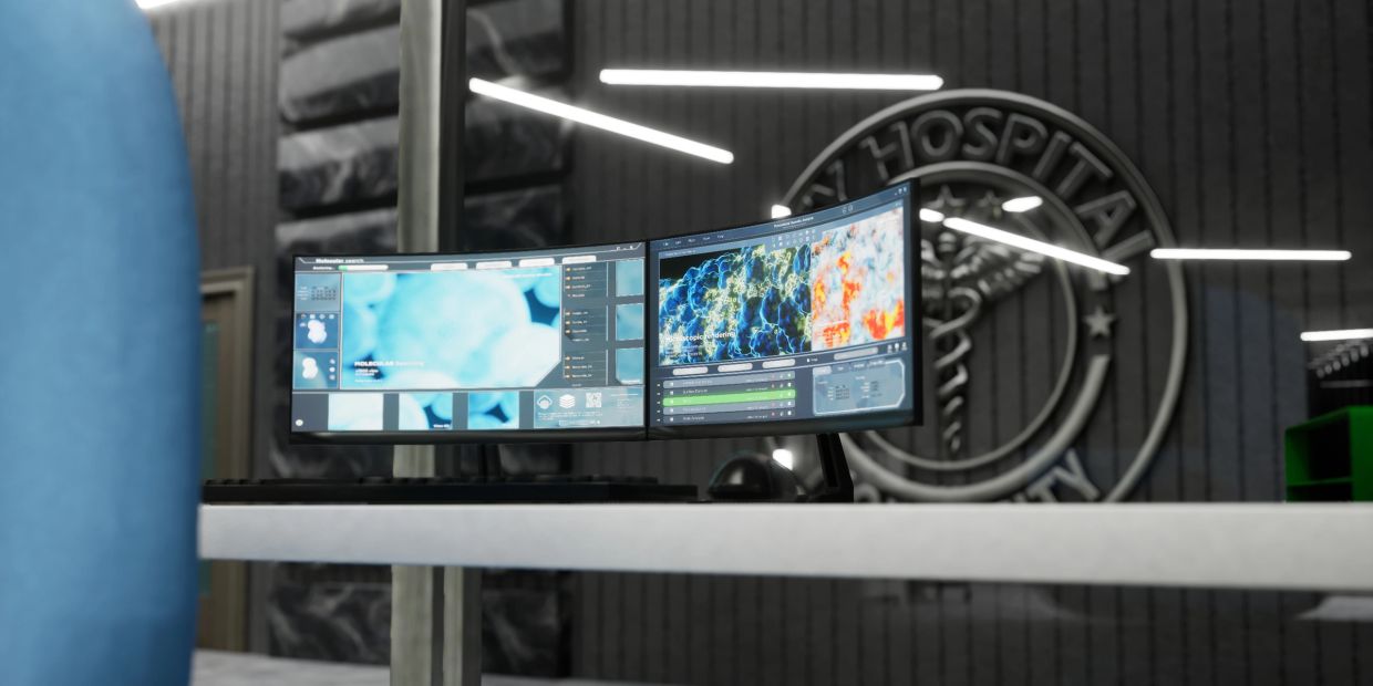Dual monitors on a hospital desk showing medical images.