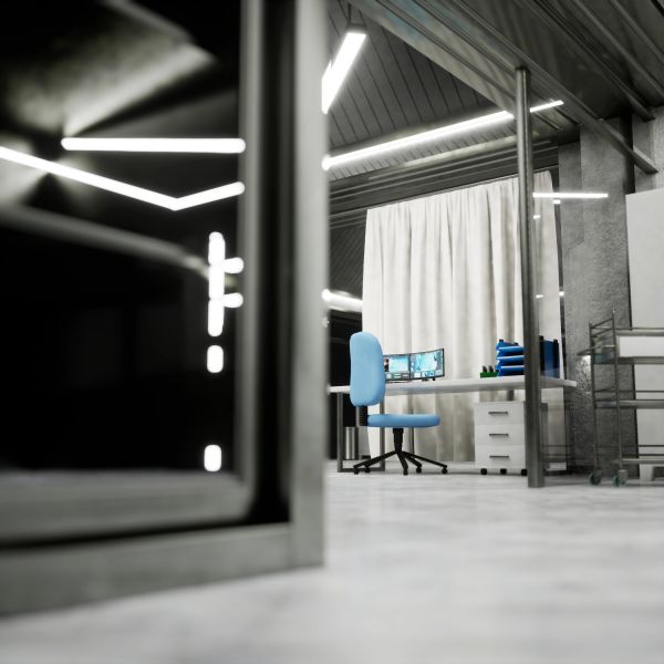 Oficina moderna con silla azul y pantallas.