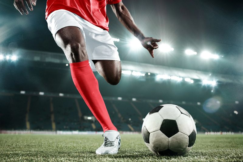 Collage. Dynamic photo of soccer player in red-white uniform moving toward ball during match, ready to score final goal and win. Concept of professional sport, game, championship, competition.