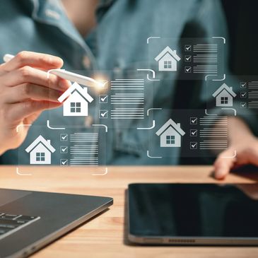 Person interacting with digital real estate icons and checklists on a transparent screen.