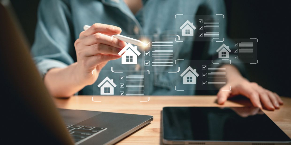 Person interacting with digital house icons and checklists.