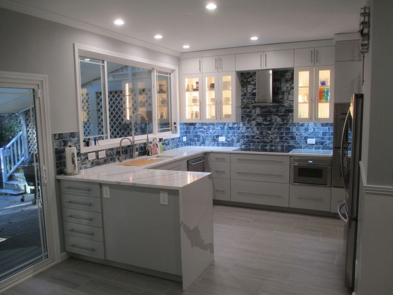 Modern kitchen with new cabinets and updated tile backsplash