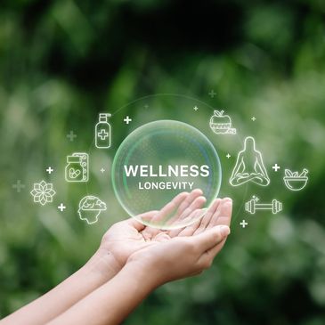 Hands holding a glowing wellness and longevity sphere.