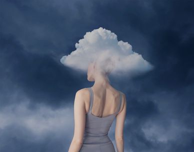 Woman with a cloud replacing her head.