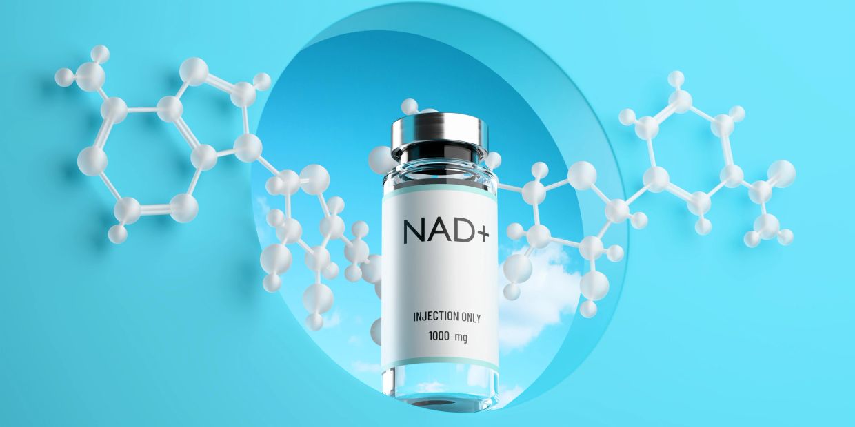 NAD+ injection vial with molecular structure on blue background.