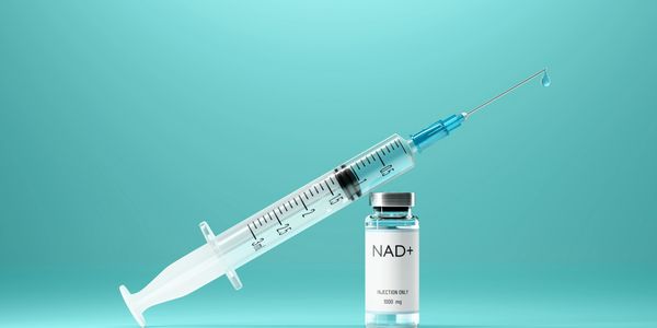 Needle & Syringe with NAD+ vessel with a bright teal background