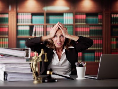 Business professional reviewing complex dispute documentation and risk exposure