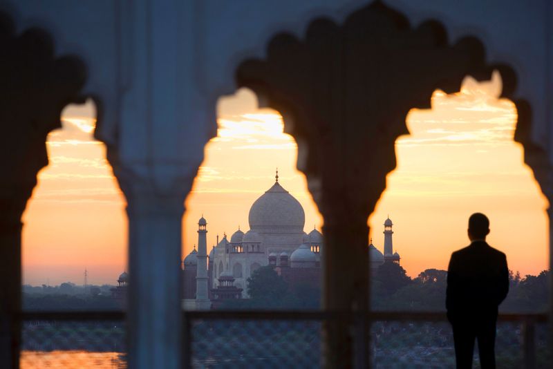 India Agra, The Taj Mahal at sunrise, male tourist looking down to tomb