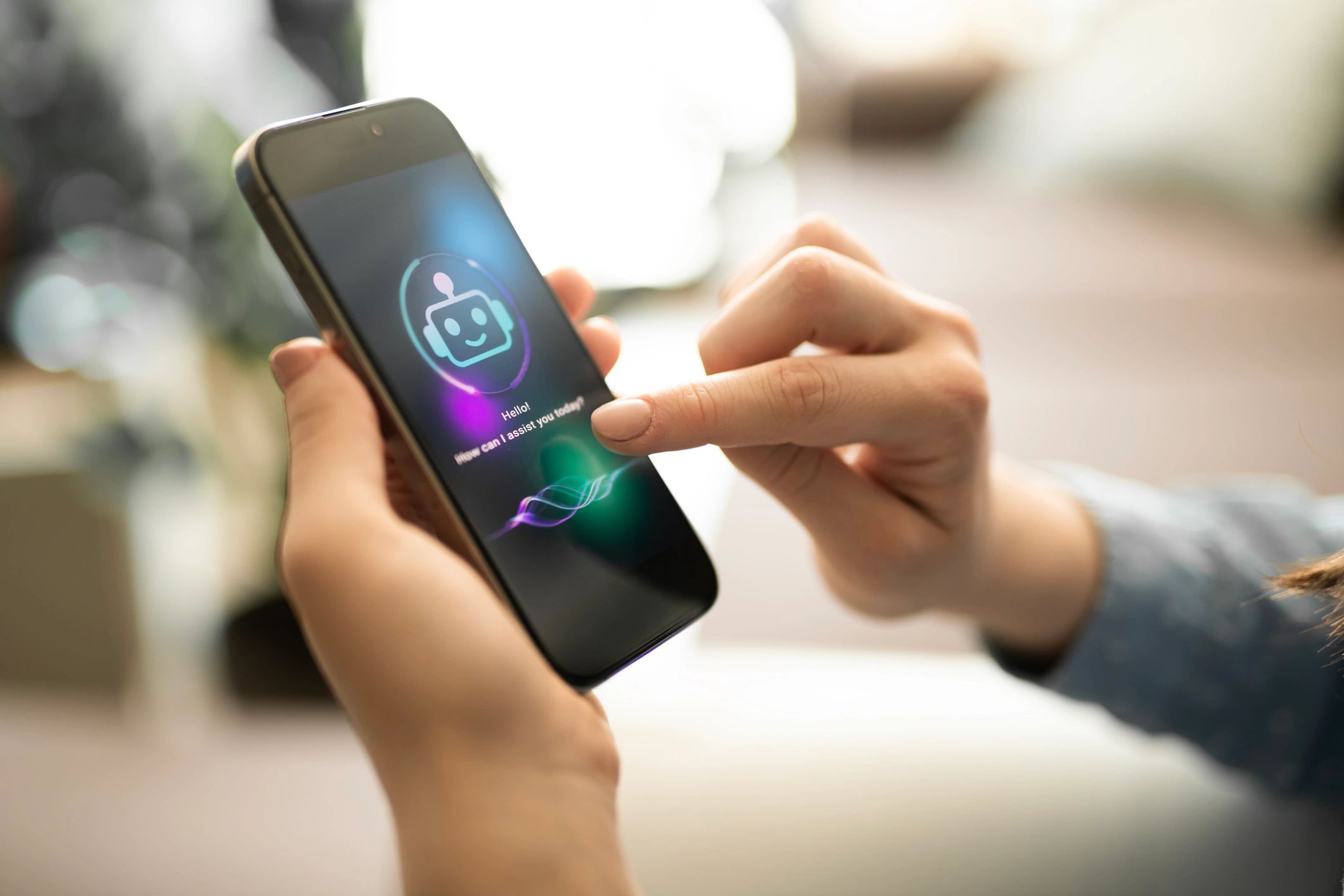 Person interacting with a chatbot on a smartphone screen.