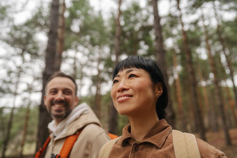 Photo of a couple exploring the woods together