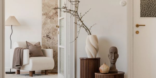 Cozy corner with armchair and decorative objects.