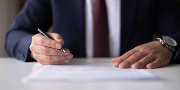 Notary signing a document.