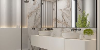 Modern bathroom with marble walls and  modern double sinks in Mukilteo, Wa.