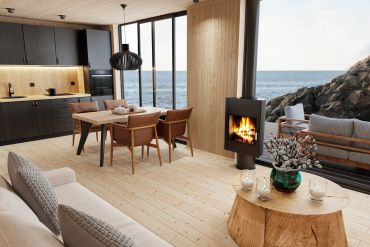Cozy modern living space with ocean view and fireplace.