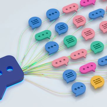 Colorful chat bubbles connected by lines from a blue speech icon.