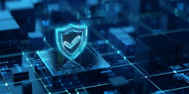 Digital shield with checkmark representing cybersecurity protection on a futuristic circuit board.