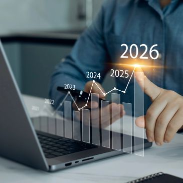 Person interacting with a futuristic growth chart from 2022 to 2026 on a laptop.