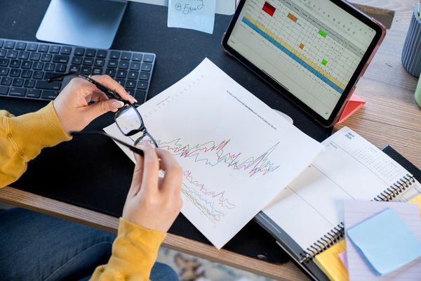 Business team analyzing laptop data.