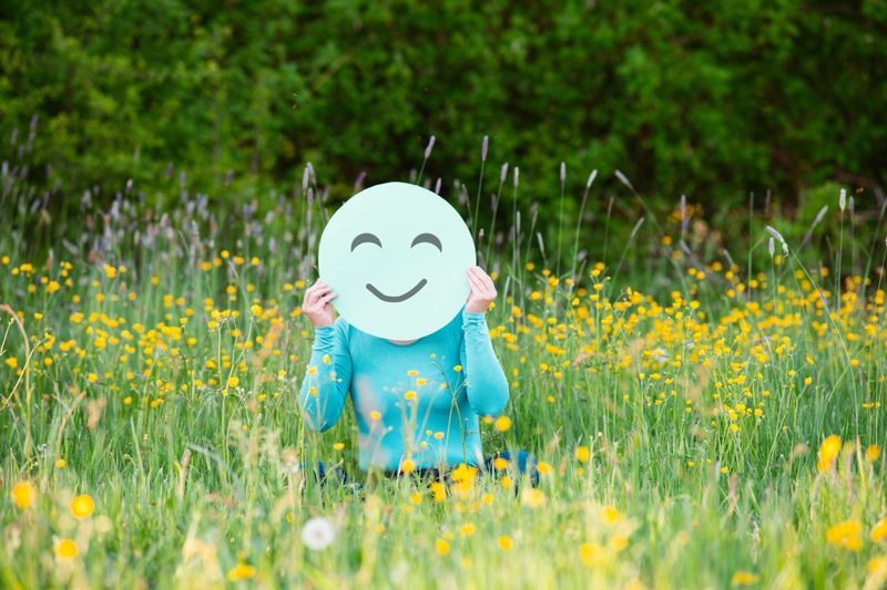 Happy smiling face, mental health concept, positive thinking, work life balance, power, strength and wellbeing, self care, calm mind in nature