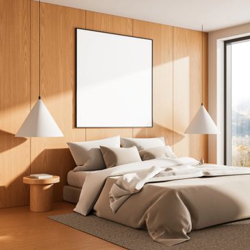 Minimalist bedroom with wooden walls, neutral bedding, and modern pendant lights.