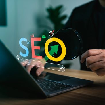 Person analyzing SEO on laptop with magnifying glass.