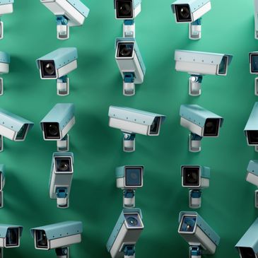 Multiple security cameras facing various directions on a green background.