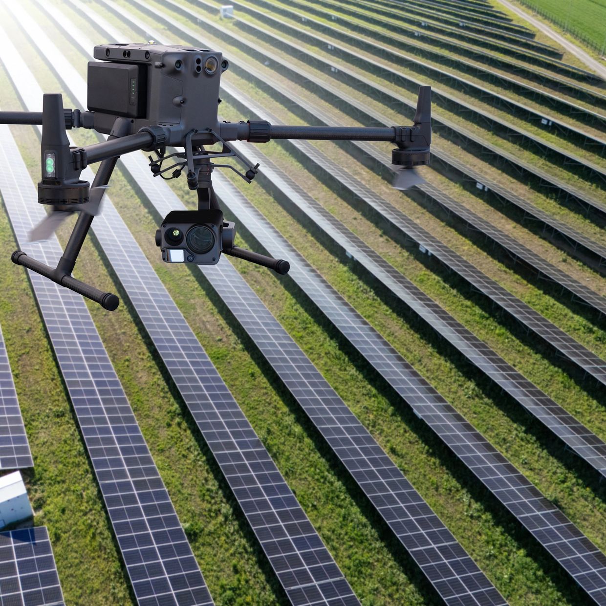 Drone flying over a solar panel farm for inspection.