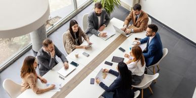 Business meeting with diverse colleagues around a table.