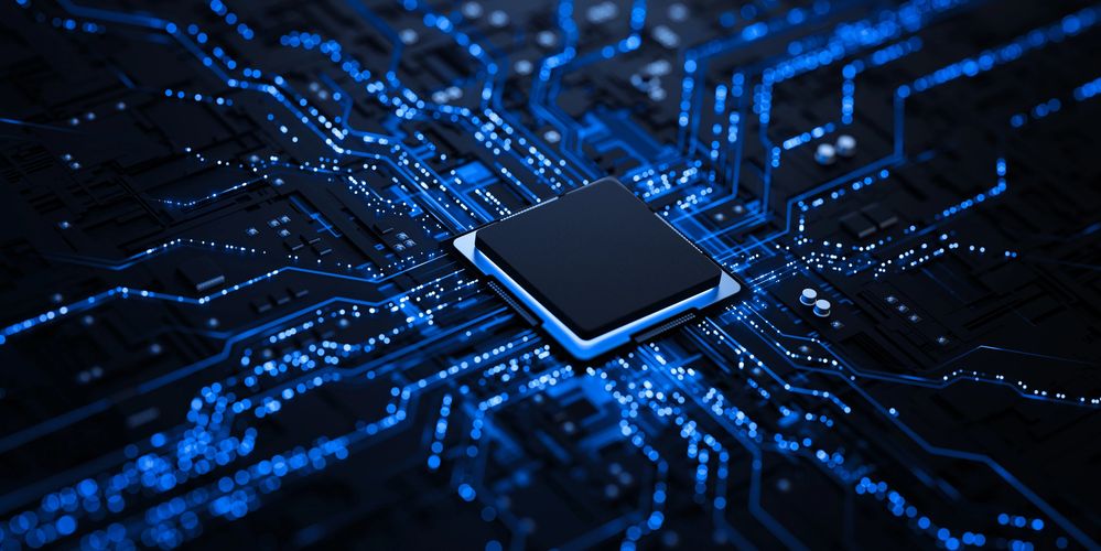 Close-up of a glowing blue circuit board with a central microchip.