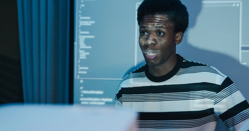 Closeup diverse group of IT professionals presenting coding and network security in office at night. Artificial intelligence and programming concept