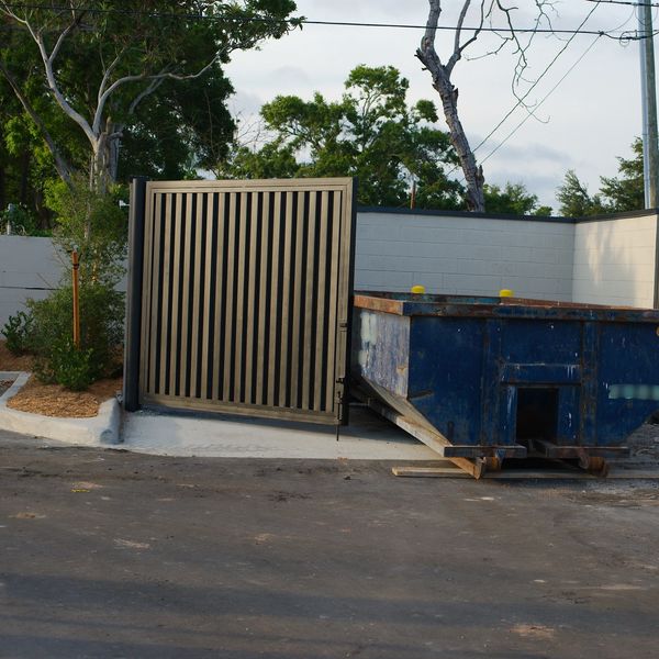 Clean commercial dumpster pad after professional pressure washing in Springfield MO