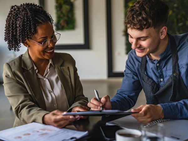 notarization over documents at a table with mobile notary