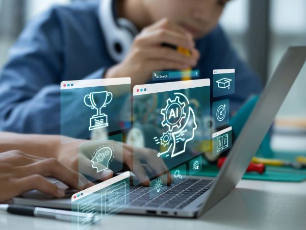 Person working on a laptop with AI graphics.