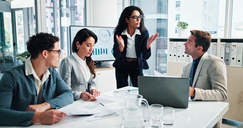 Office, business people and project manager with paperwork for discussion, meeting and finance update. Team, accountants and financial advisor with documents for risk management, feedback and explain