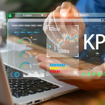 Person interacting with a futuristic KPI data dashboard on a laptop.