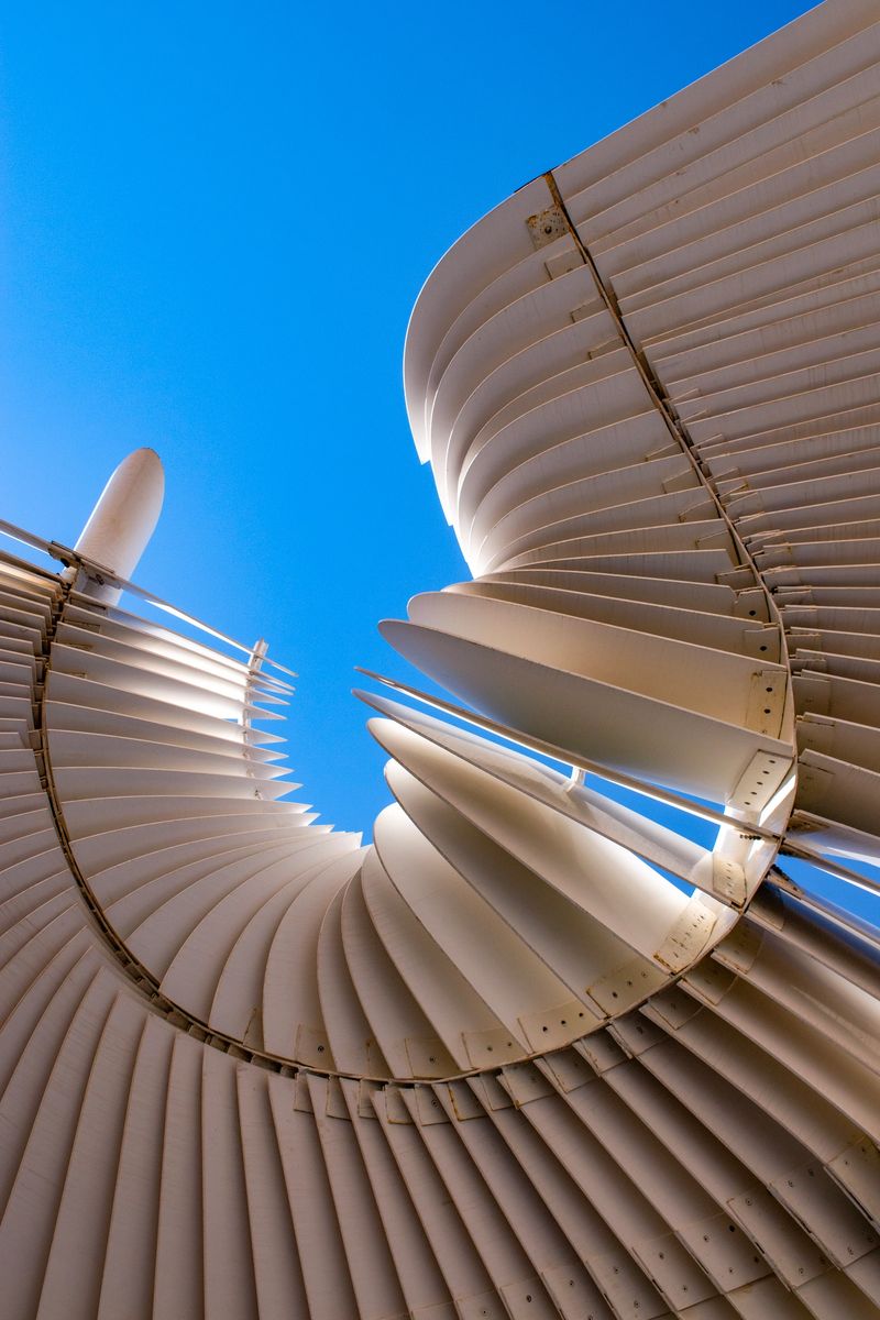 Muscat, Oman: a white spiral, metal cover for a roof. Conceptual, abstract, background, infinity symbol, wave. Close up of a building in the old town of Muscat
