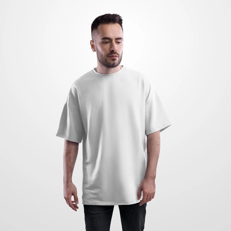 Template of a white oversized t-shirt on a bearded man in black jeans, front view, for design, print, pattern, branding. Mockup of a street shirt, male clothing, isolated on a background