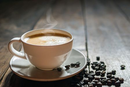 Woman brewing coffee.