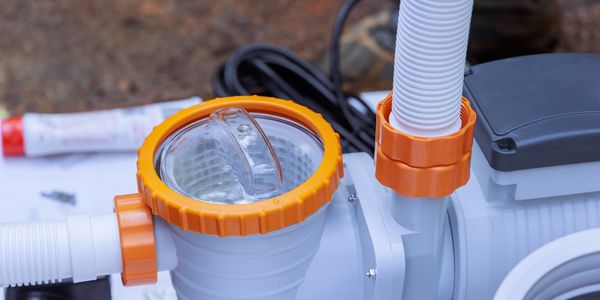 Inspecting pool equipment during initial service in Land O’ Lakes.