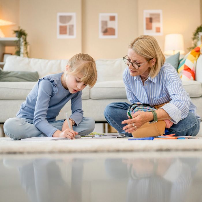 Speech therapist working with child during in-home speech therapy session