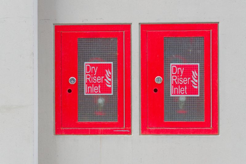 Dry riser inlet cabinet located on building UK