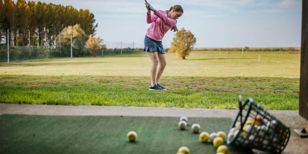 Indoor golf training session in action.