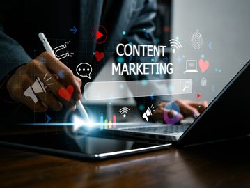 Person working on content marketing with digital icons.